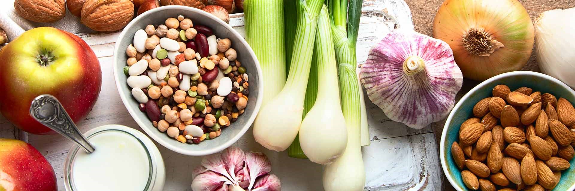 A selection of prebiotic foods, such as onions, garlic, seeds and nuts