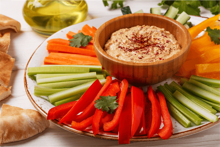 Hummus with red pepper and carrot batons