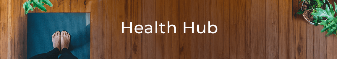 Smiling woman in cardigan looking at her phone