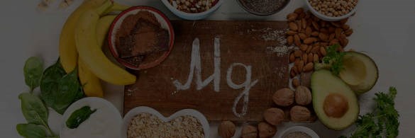 Mg symbol on background of magnesium-rich foods