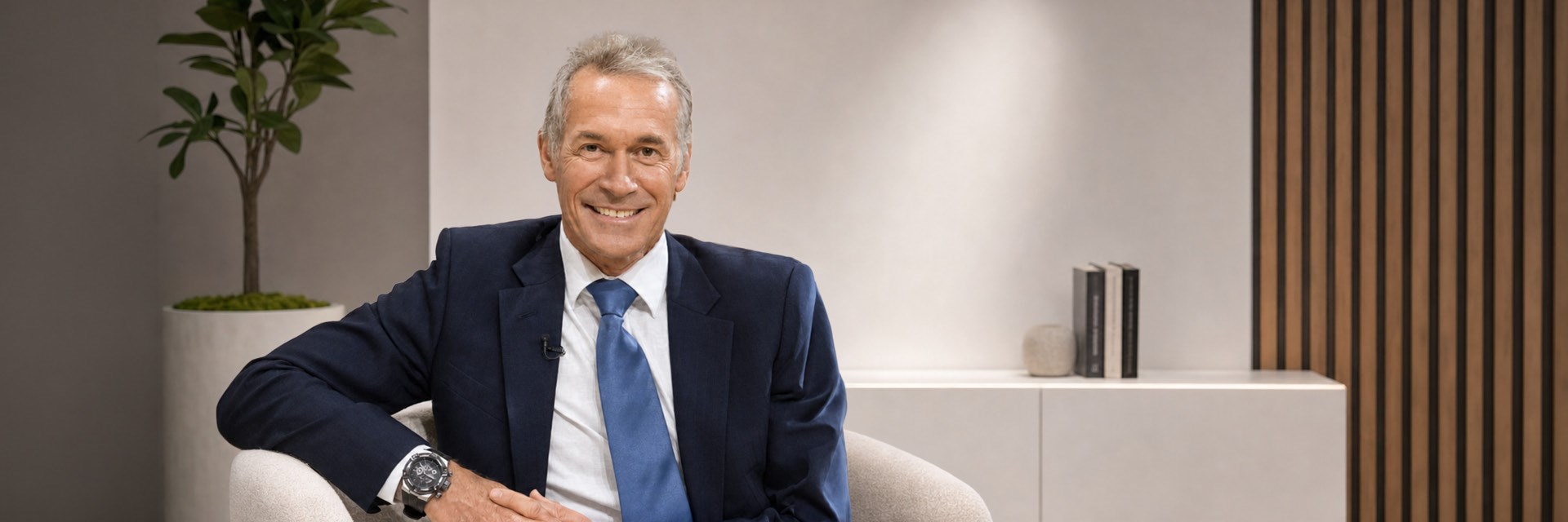 Dr Hilary Jones in front of an illustration of a heart