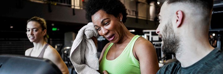 Woman at the gym with personal trainer