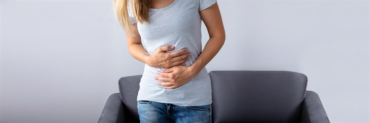 A woman holding her stomach
