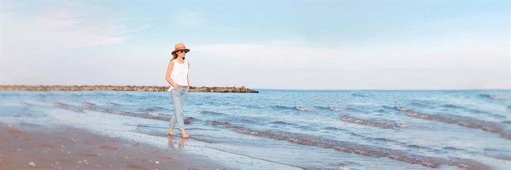 A woman walking on a beach