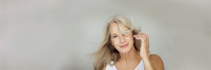 Older lady smiling and posing