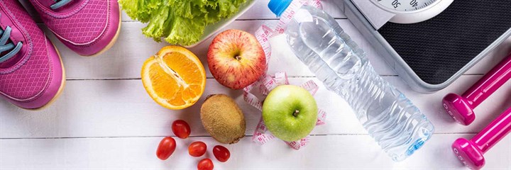 Trainers, fruit and weighing scales