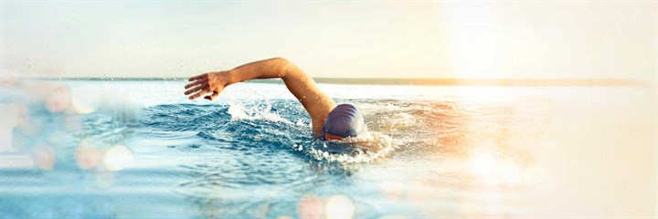 A man swimming outside