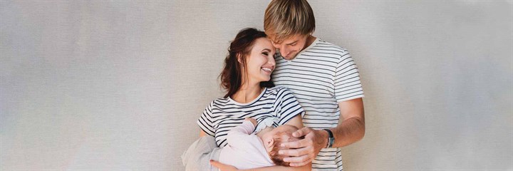 A happy couple with a baby