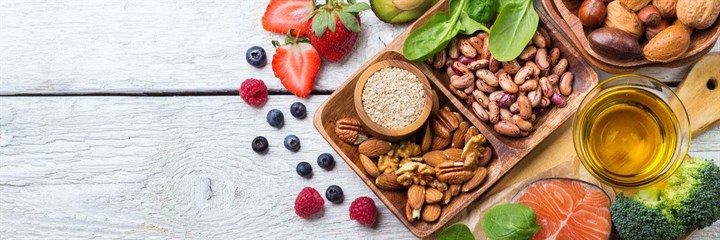 Fruit and nuts in wooden bowls