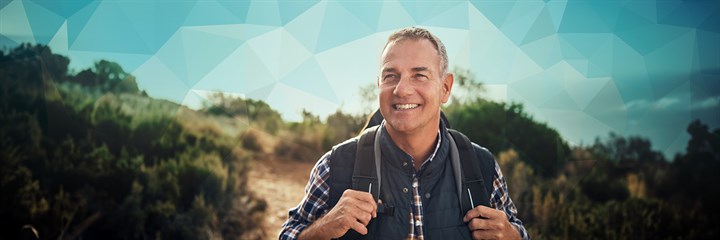 Smiling man walking in the countryside