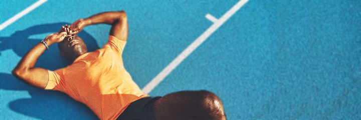 Athlete lying on track
