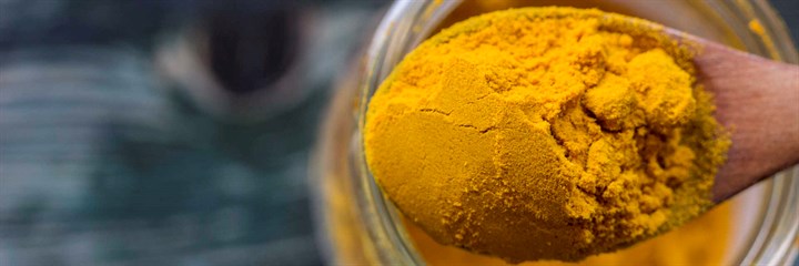 Close-up of turmeric powder on a spoon