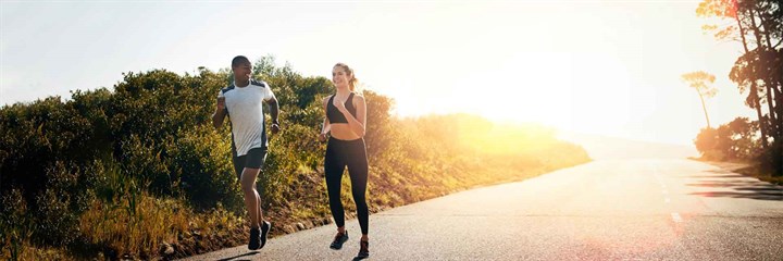 A couple running in the evening sun