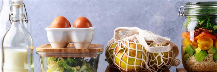 Milk, eggs, apples and salad in containers