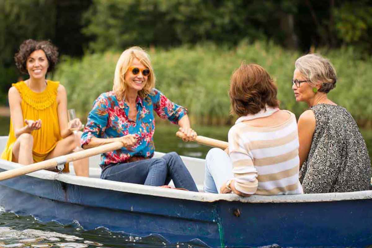 Happy women in a rowing boat