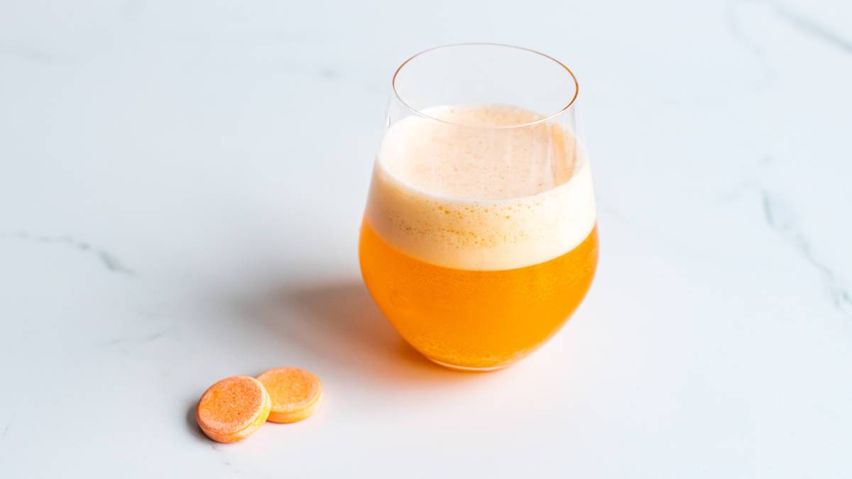 Effervescent vitamin tablets and drink in glass