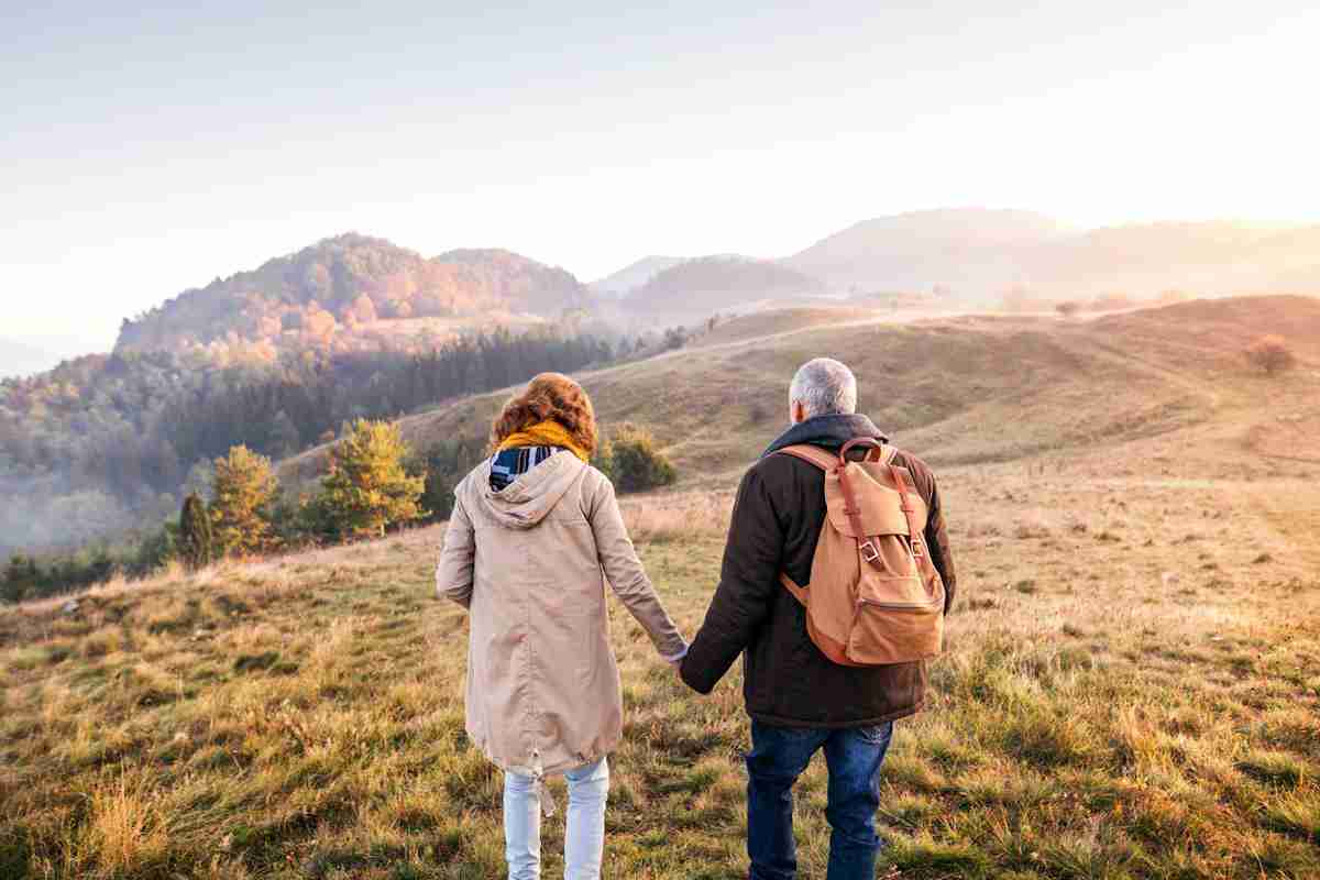 Couple going on an early-morning walk in the autumn
