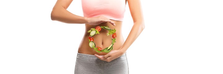 Woman with circle of salad in front of her stomach