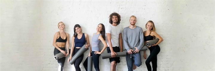 A group of people ready to do yoga