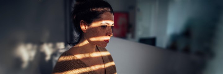 Woman with light on face