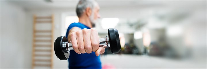 Image of a man lifting arm weights