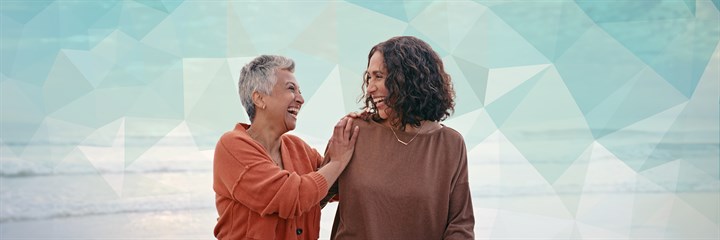 Older and younger woman together smiling