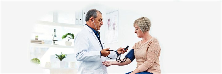 Doctor doing blood pressure test